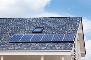Large blue tile roof with solar panel